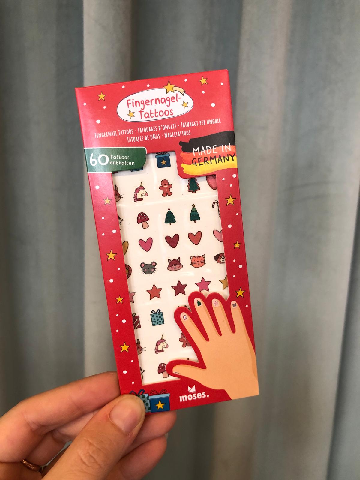 Tatuaggi unghie natale