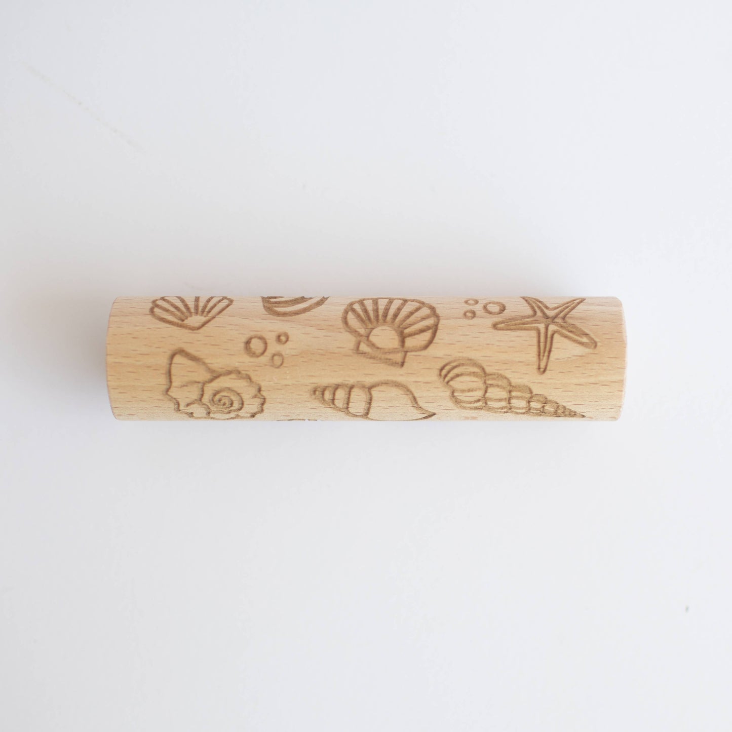 Rullo di legno con motivi a conchiglie