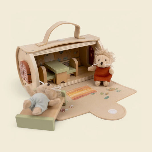 Log house with miniature friends